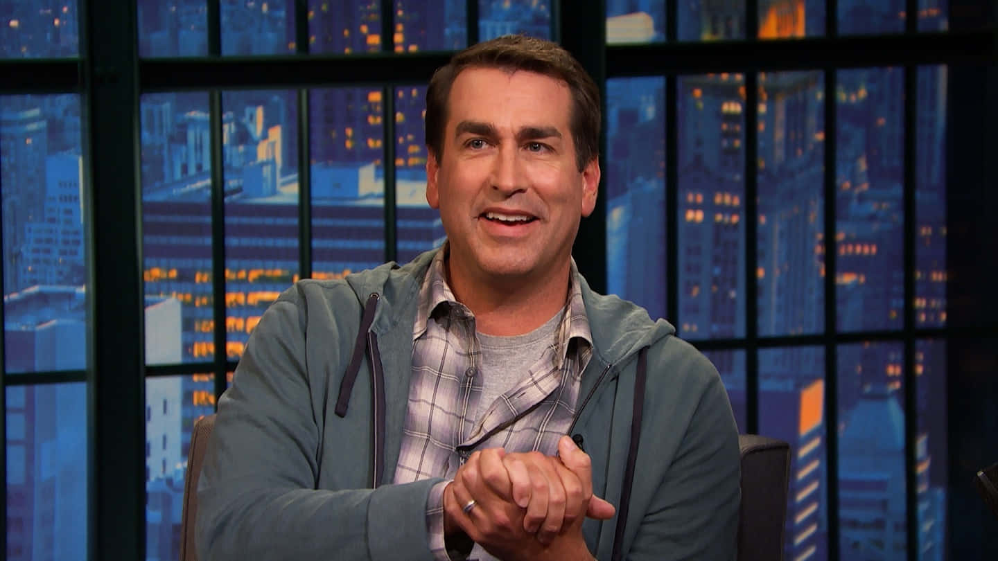 Hollywood Comedian Rob Riggle Glowing in Spotlight Wallpaper