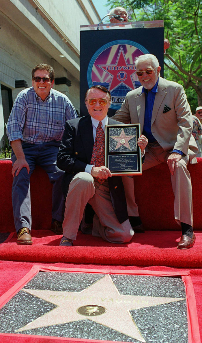 Robert Vaughn holding his Star award on the Hollywood Walk of Fame Wallpaper