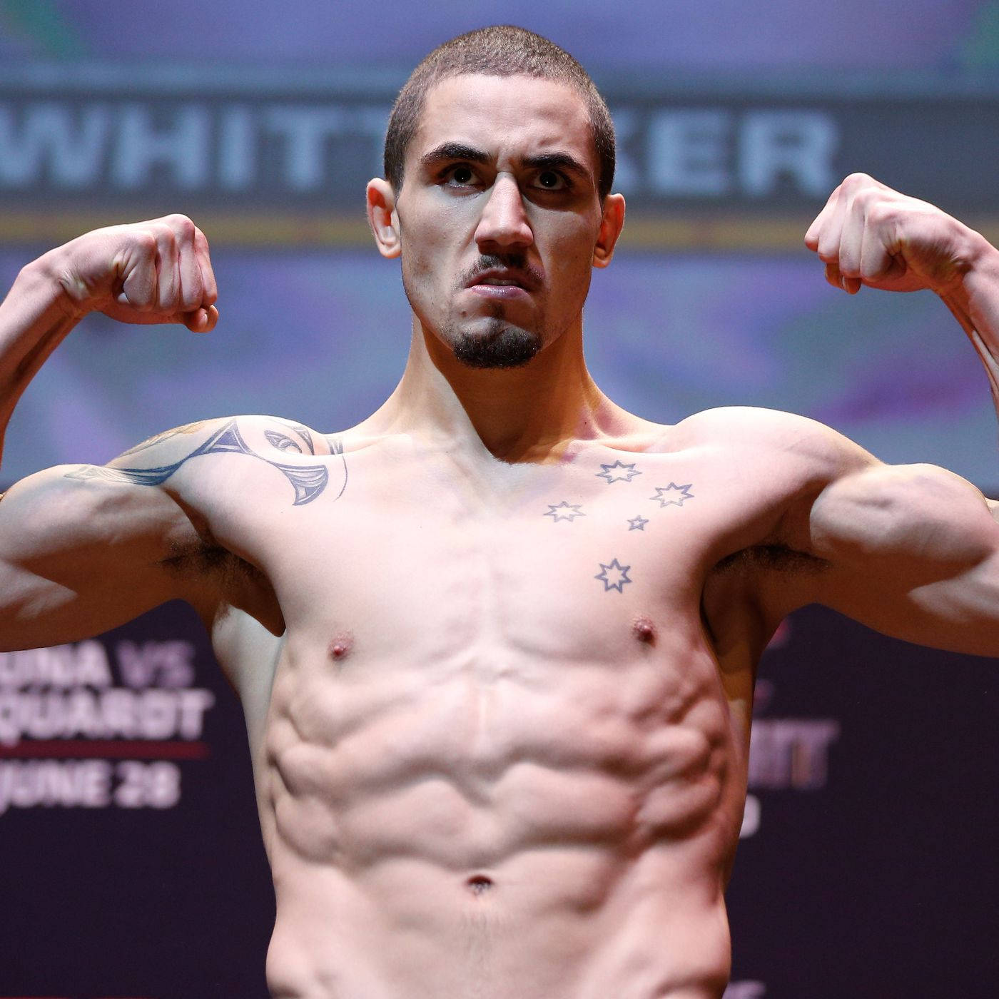 Robert Whittaker Doing Front Double Bicep Pose Wallpaper