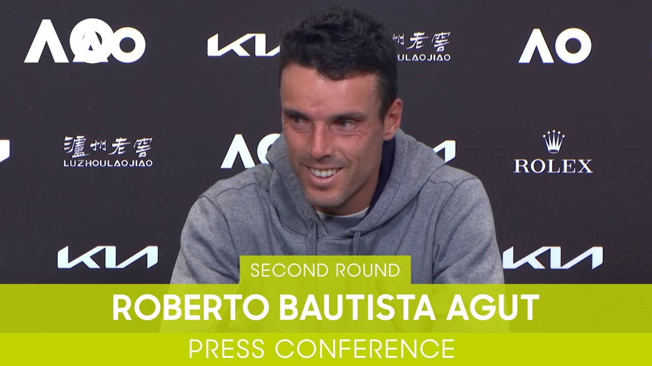 A thoughtful Roberto Bautista Agut at a press conference Wallpaper
