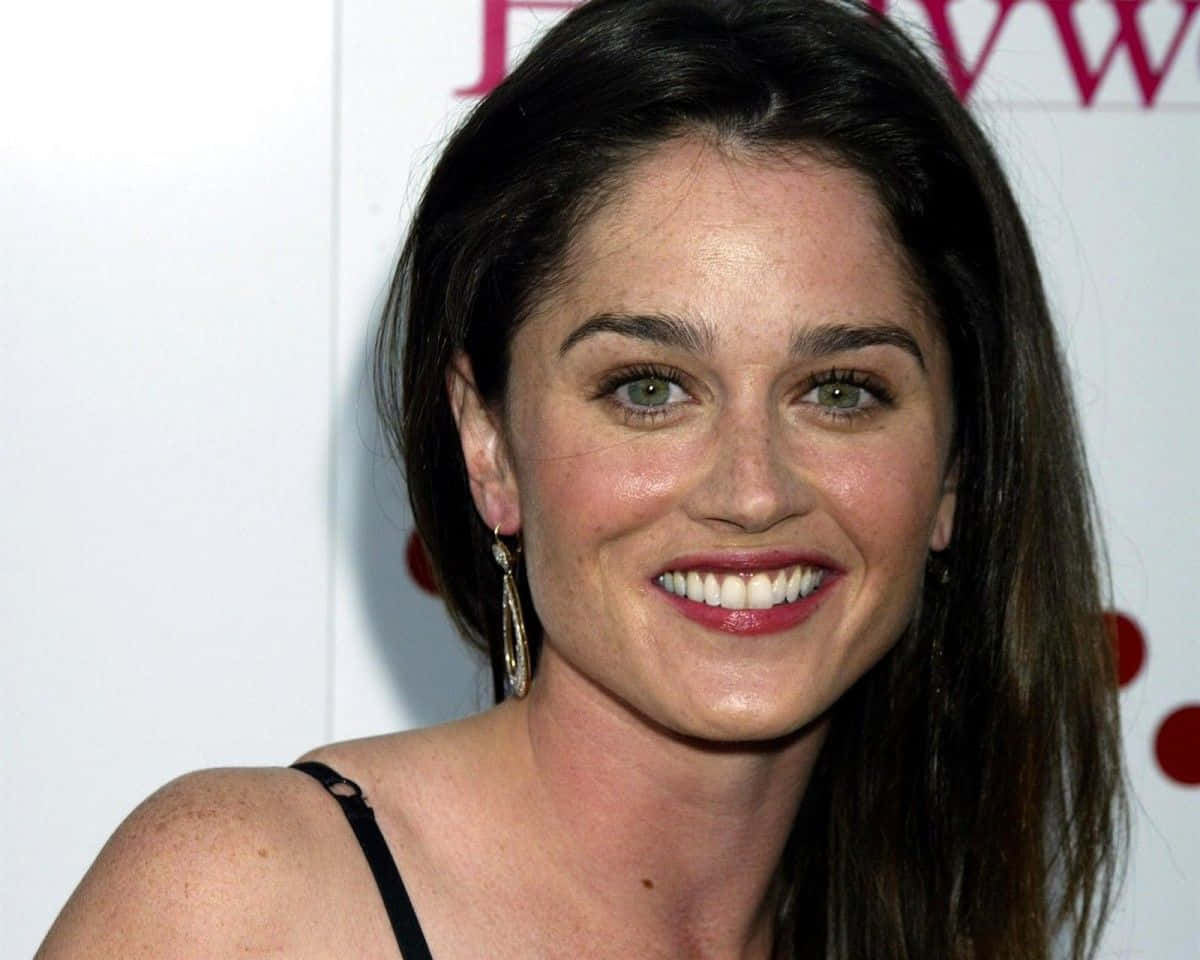 A radiant Robin Tunney smiling in a close-up portrait Wallpaper