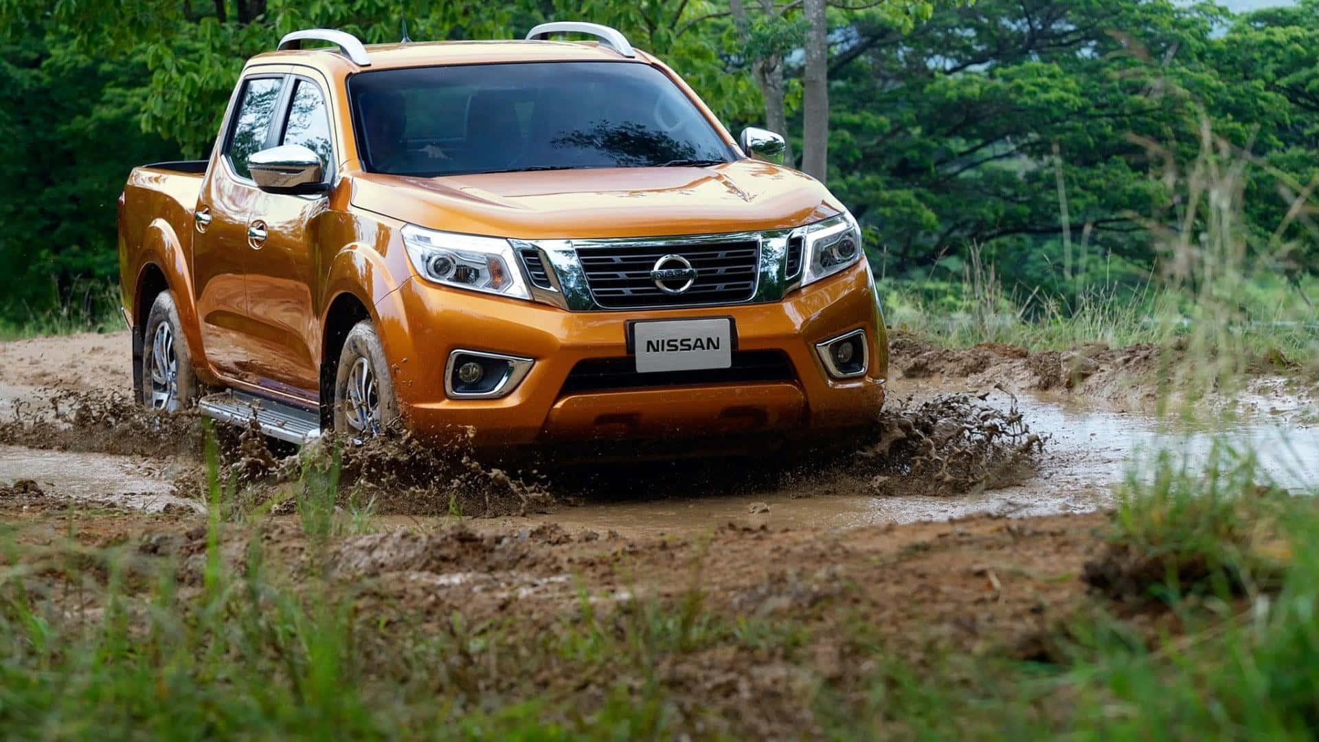 Robust Nissan Frontier Enjoying The Outdoors Wallpaper