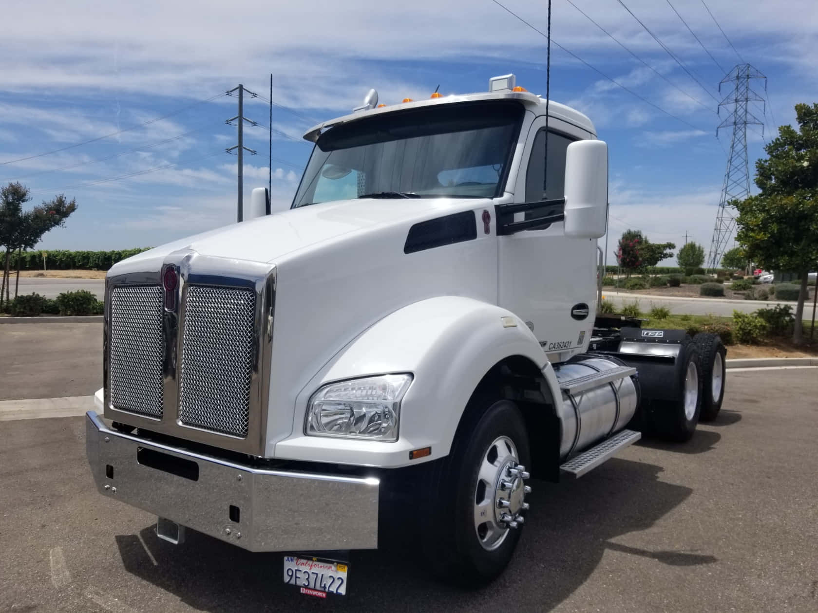 Robust Red Kenworth T880 Truck On The Road Wallpaper