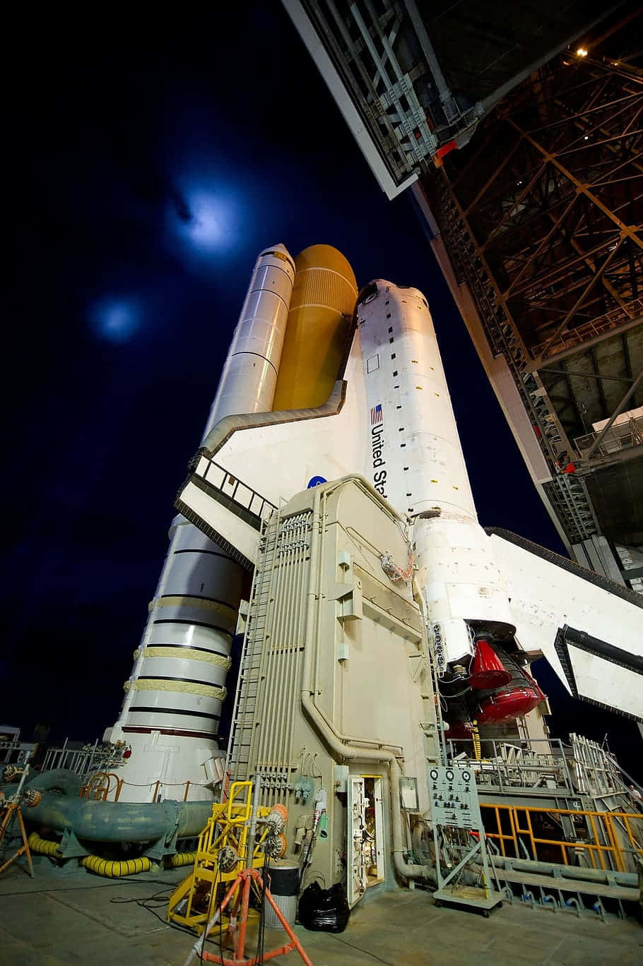 A Space Shuttle Is Sitting In A Dark Building
