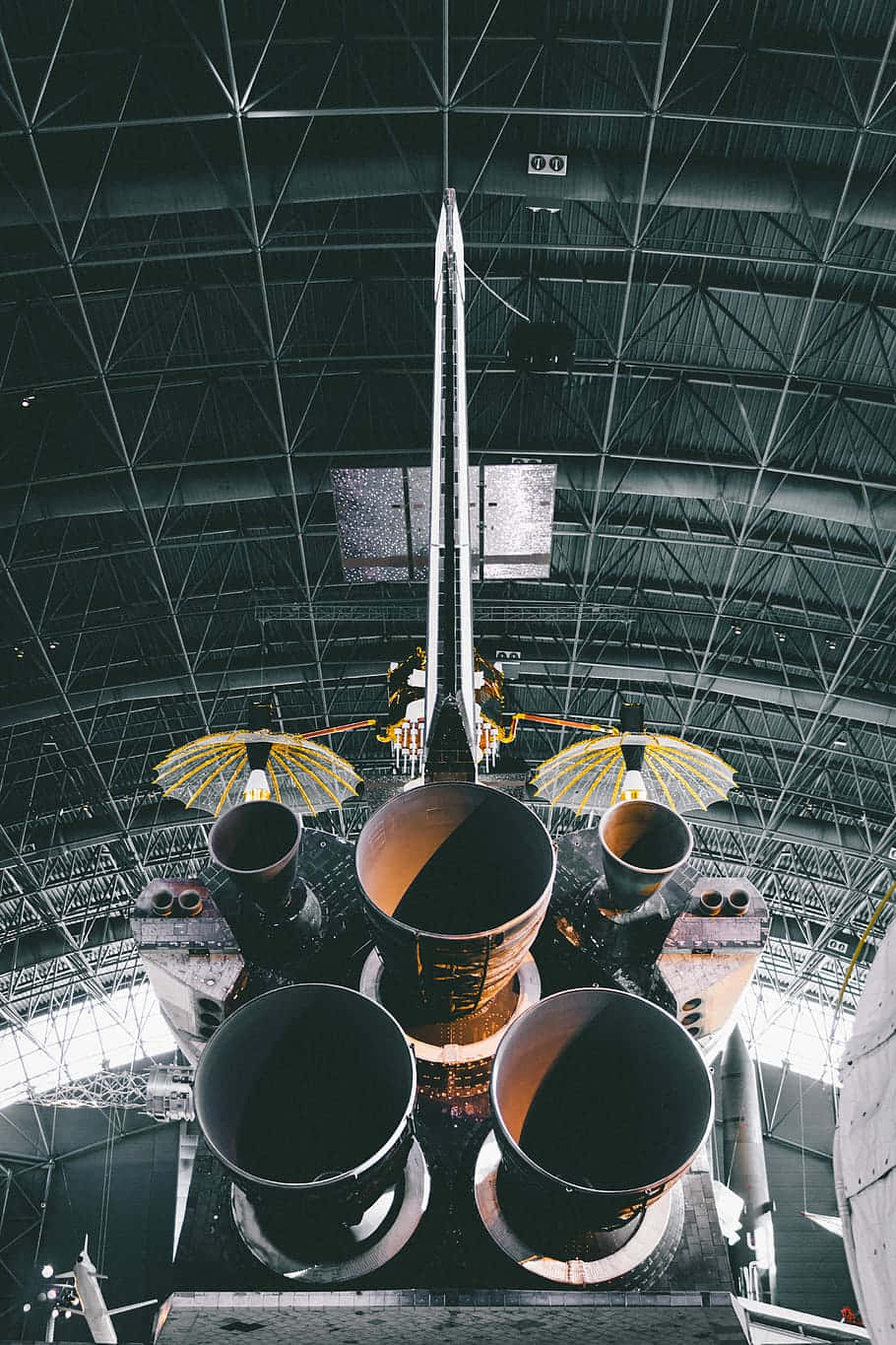 A Large Spacecraft Is Sitting In A Hangar