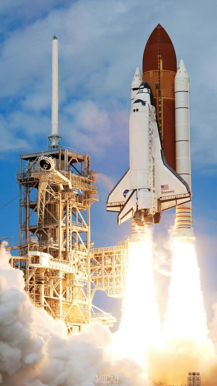 A Space Shuttle Is Taking Off With Smoke Coming Out Of It
