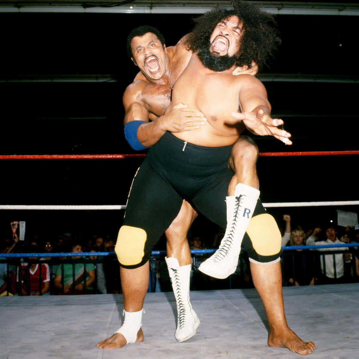 Legendary Wrestler Rocky Johnson in Action Against Sika Wallpaper