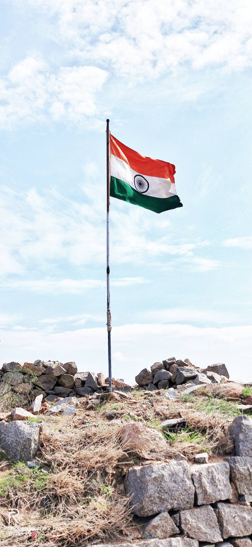 Majestic Indian Flag Adorning the Rocky Landscape in 4K Wallpaper