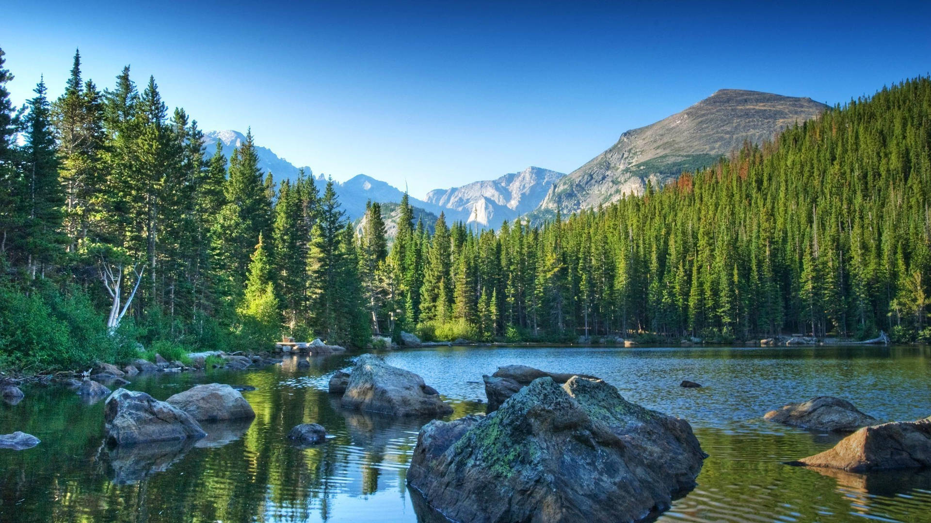 Rocky Mountain With Stone-filled Lake Wallpaper