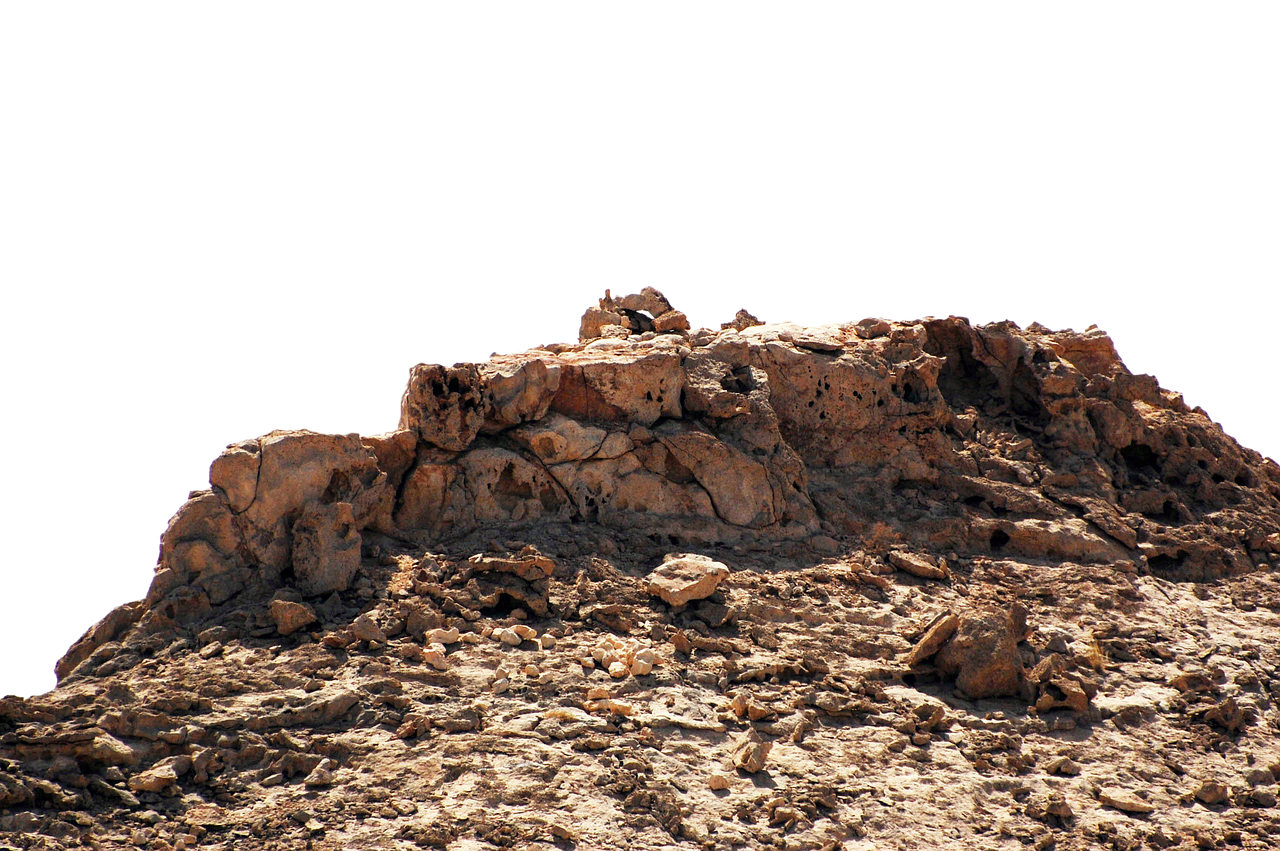 Rocky_ Outcrop_ Against_ Dark_ Background.jpg PNG