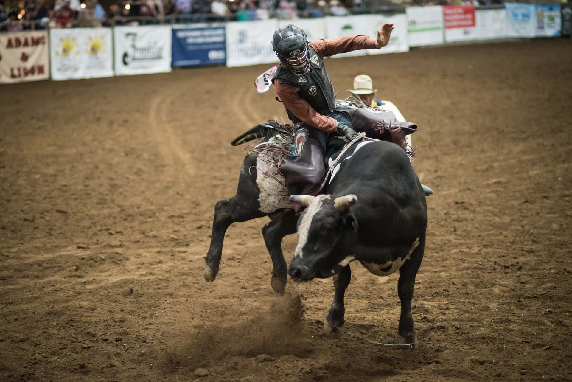 Action-packed rodeo event at a crowded arena