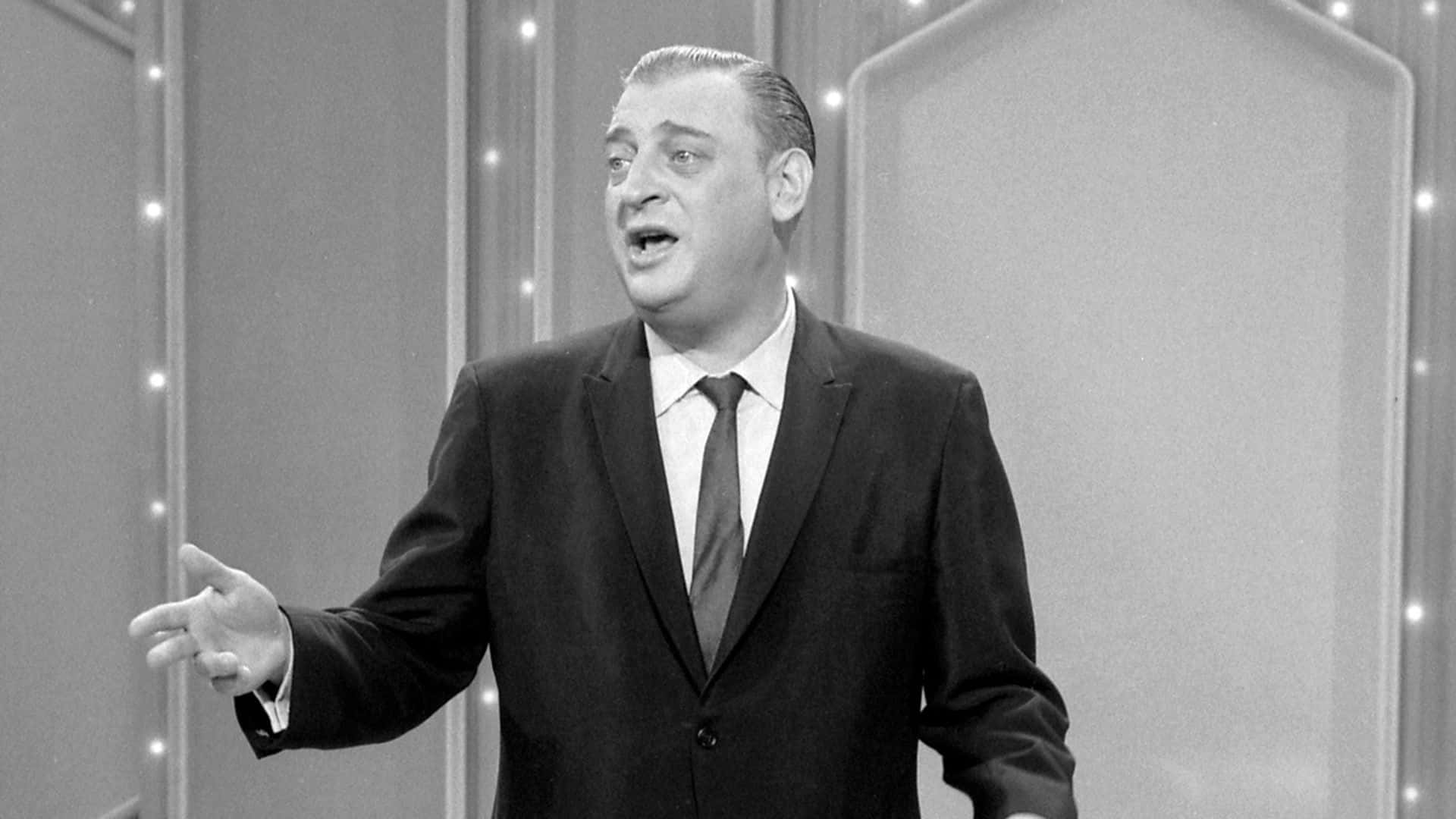 Rodney Dangerfield Gracing the Stage in Quintessential Monochrome Wallpaper