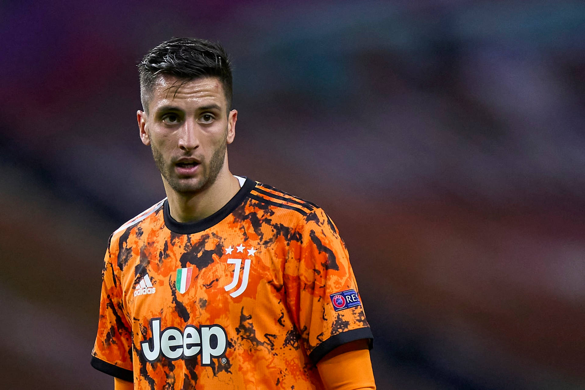 Rodrigo Bentancur Sporting His Orange Juventus Jersey Wallpaper