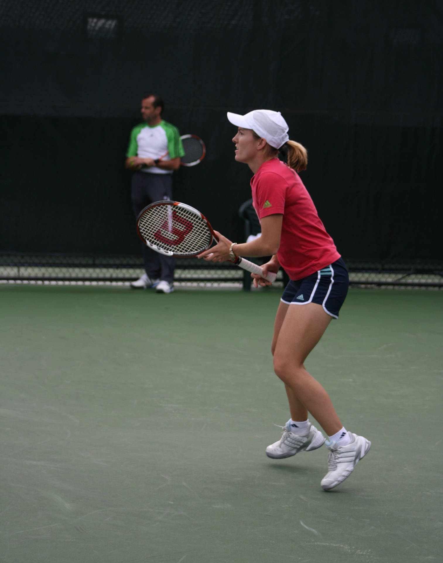 Justine Henin Showcasing Her Skills at The Rogers Cup Wallpaper