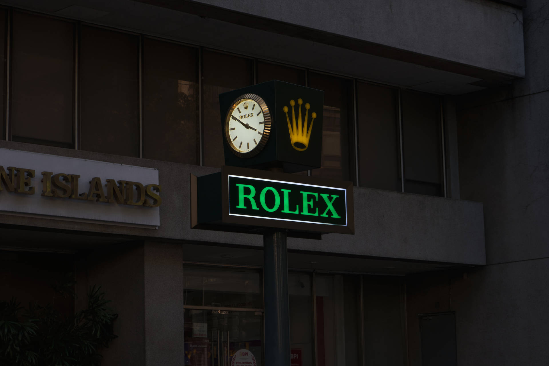 Segnaletica Dell'orologio Con Logo Rolex Sfondo