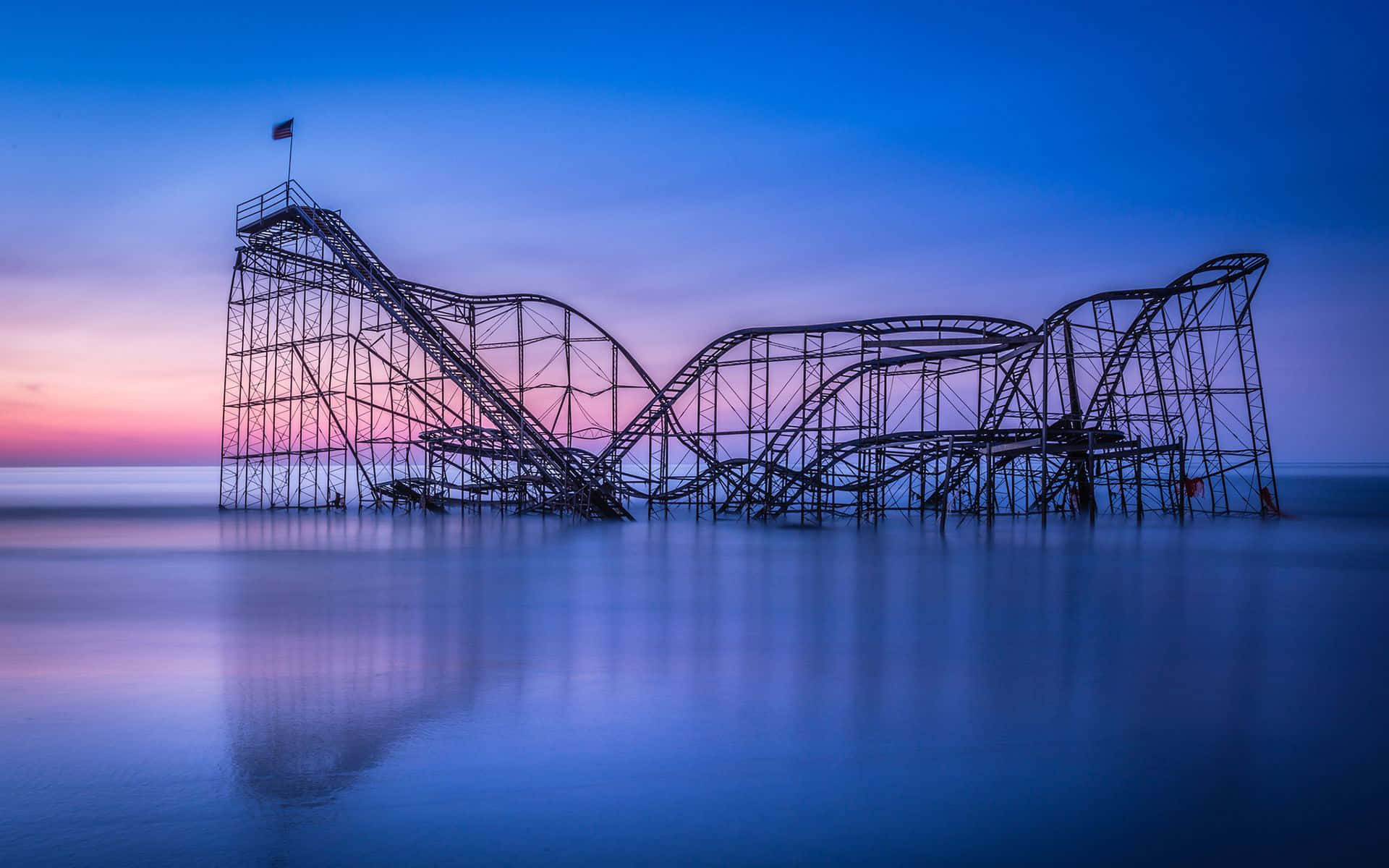 Captivating Roller Coaster Ride Against a Beautiful Sunset