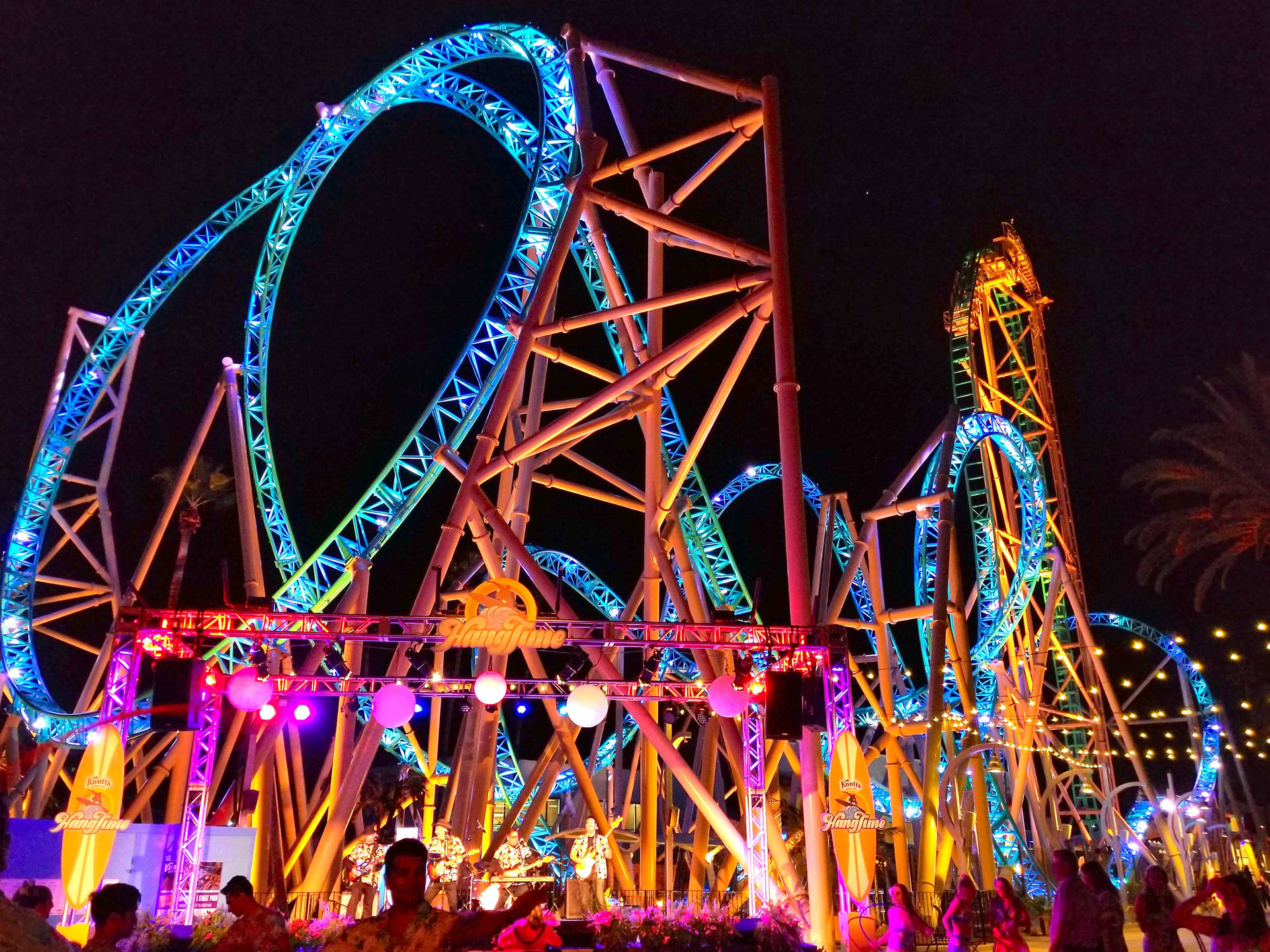 Roller Coaster Ride In Neon Lights Wallpaper