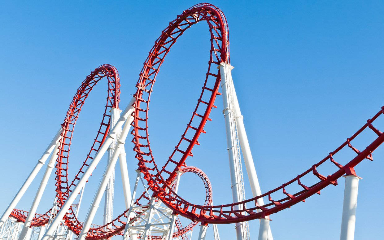 Thrilling Double Loop Roller Coaster Ride Wallpaper