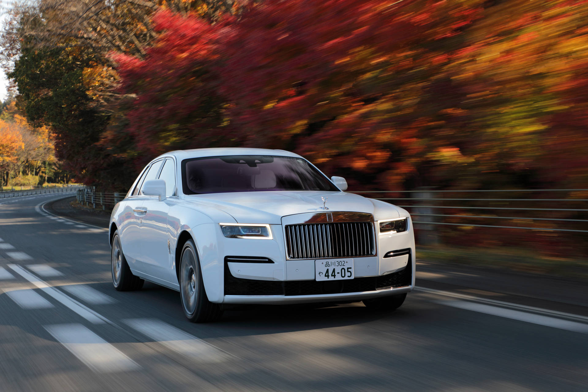 Rolls-Royce 4K Ghost Speeding Autumn Leaves Wallpaper