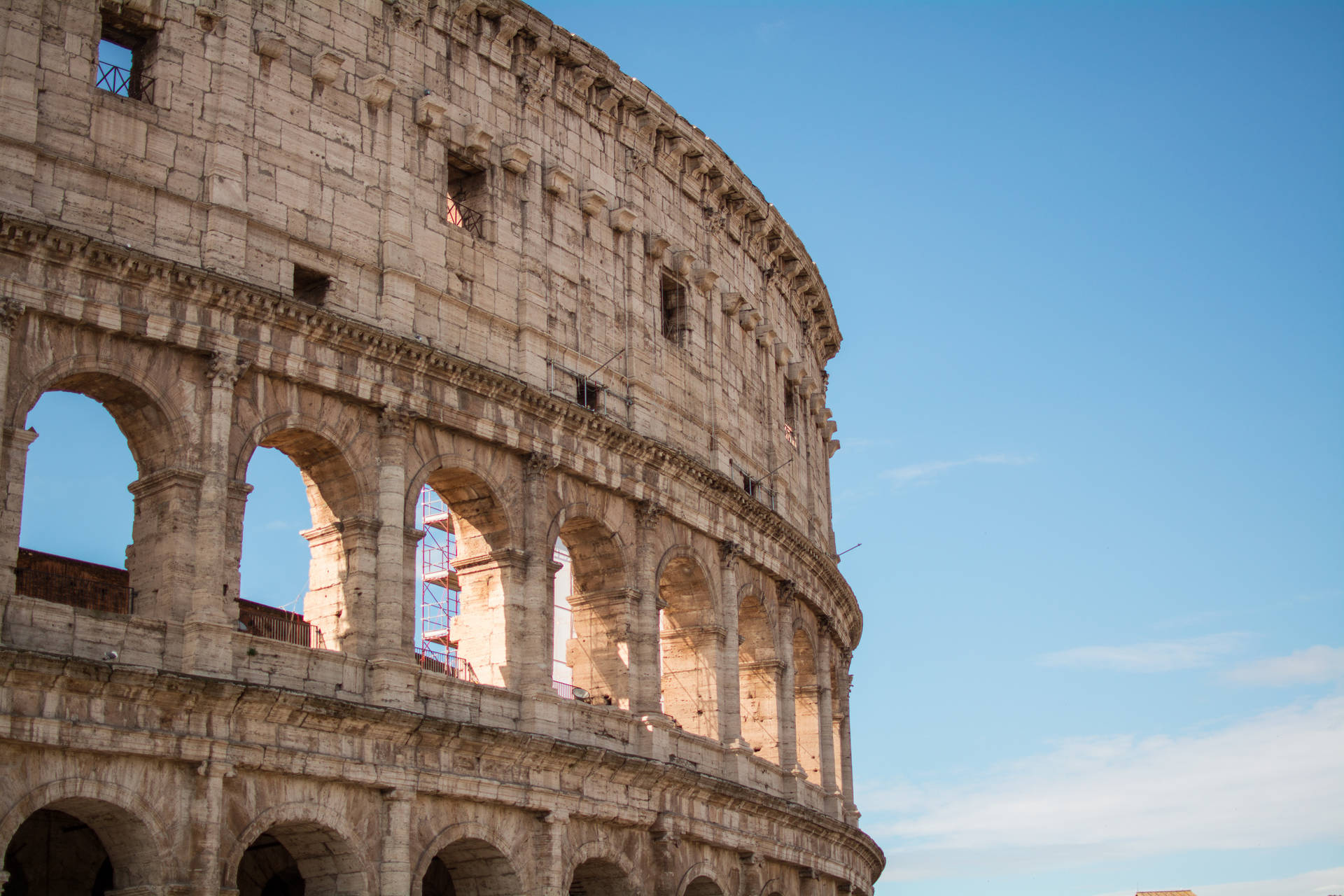 Roman Colosseum In Front Of The Blue Sky Wallpaper