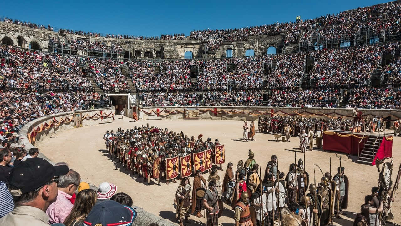 Unagrande Folla Di Persone Che Guardano Uno Spettacolo In Un'arena