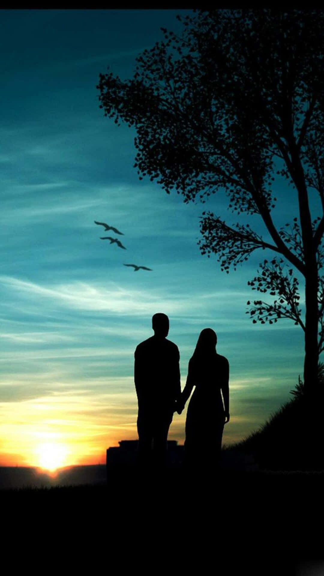 Lovers Holding Hands Against Sunset Romantic Background