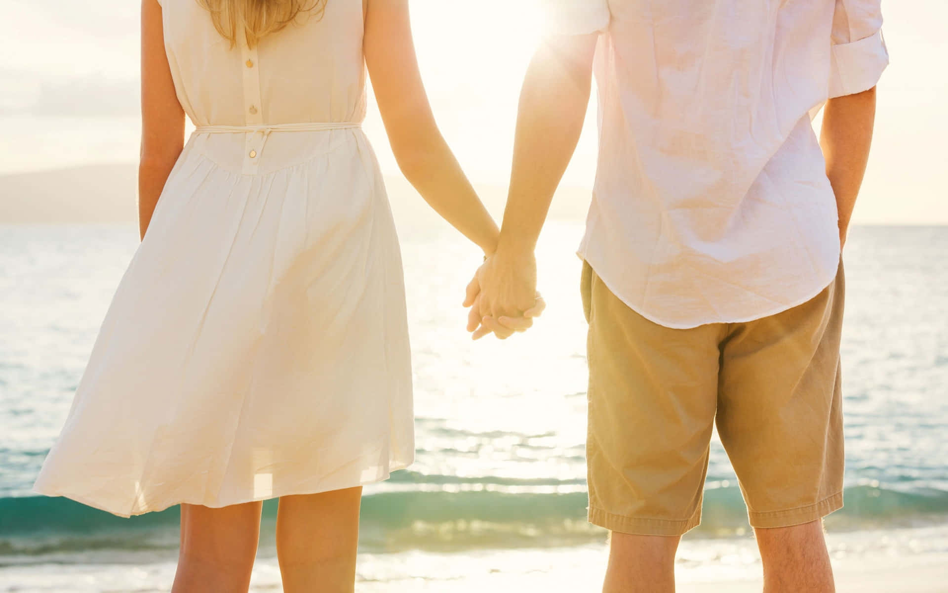 Romantic Beach Couple Holding Hands Wallpaper