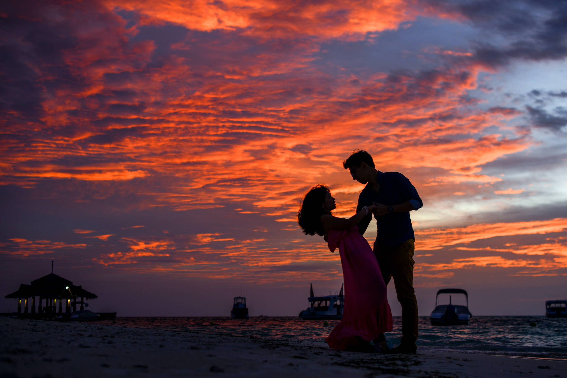 Download Romantic Couple Beach Dance At Dusk Wallpaper 