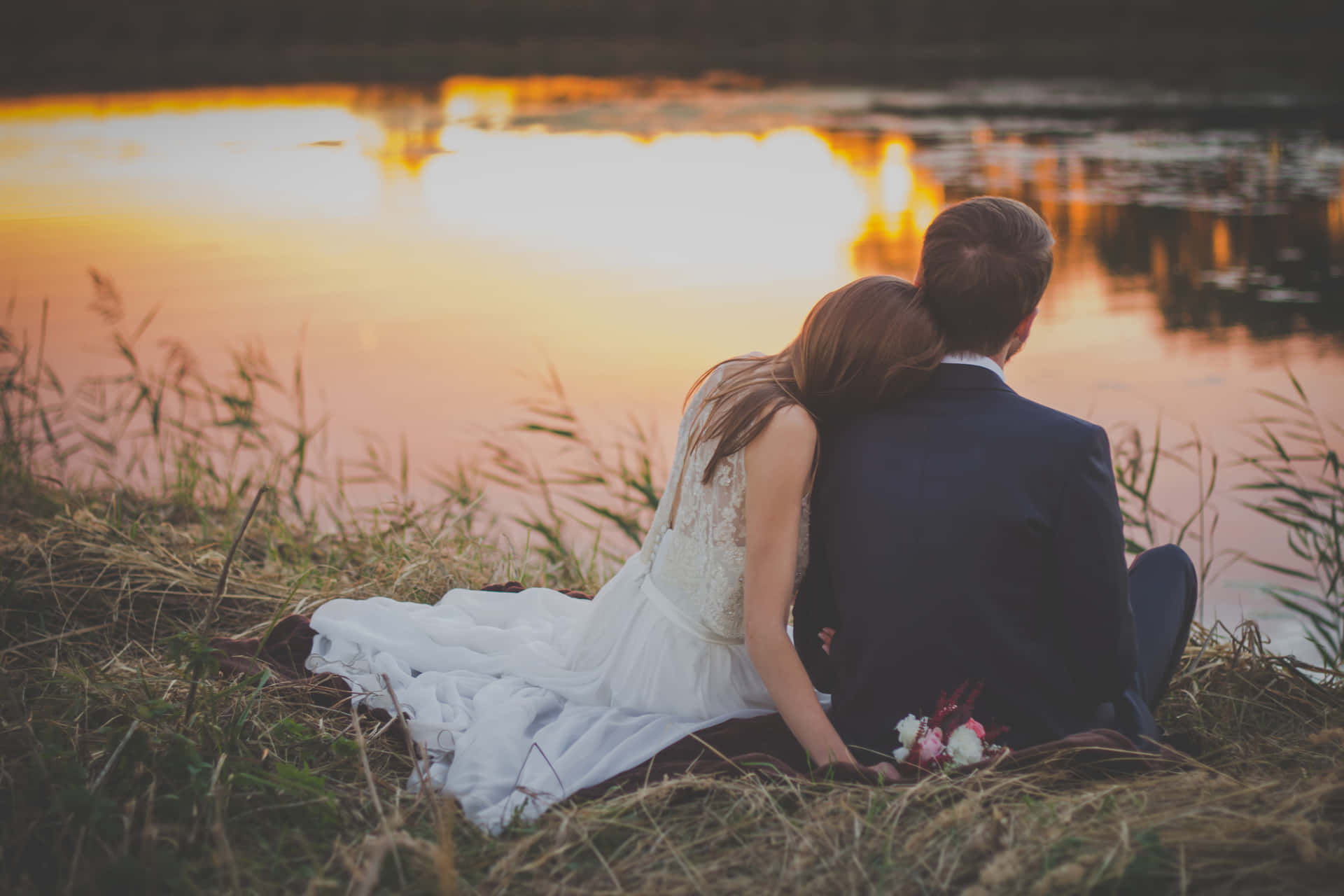 Romantic Couple Lakeside Sunset Wallpaper
