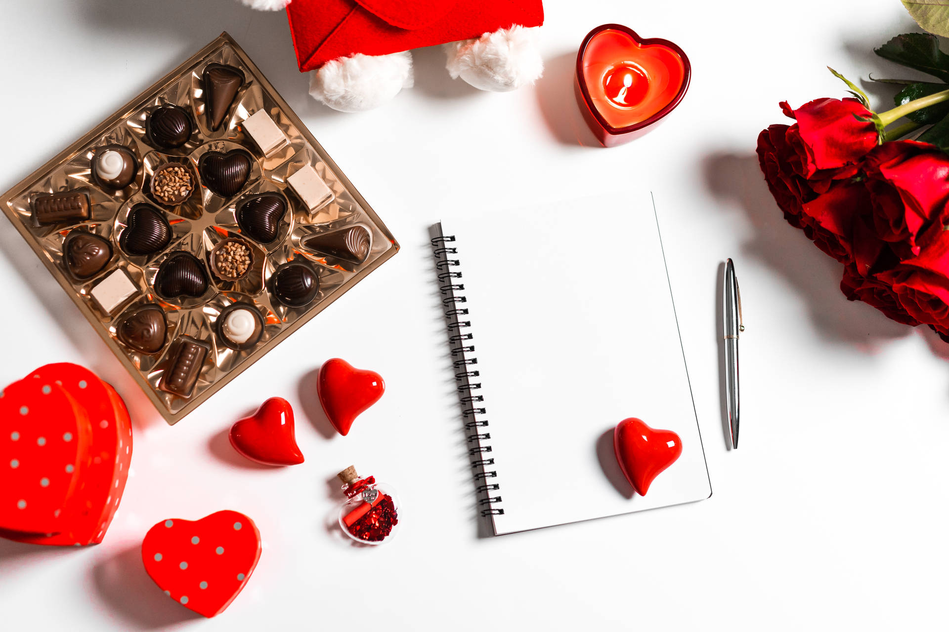 The Symbol of Love: Romantic Flowers with Chocolates and a Notebook Wallpaper
