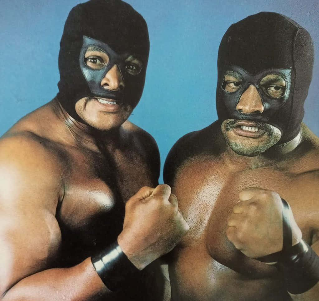 Ronsimmons Butch Reed Can Refer To A Computer Or Mobile Wallpaper Featuring Images Of The Professional Wrestlers Ron Simmons And Butch Reed. Wallpaper