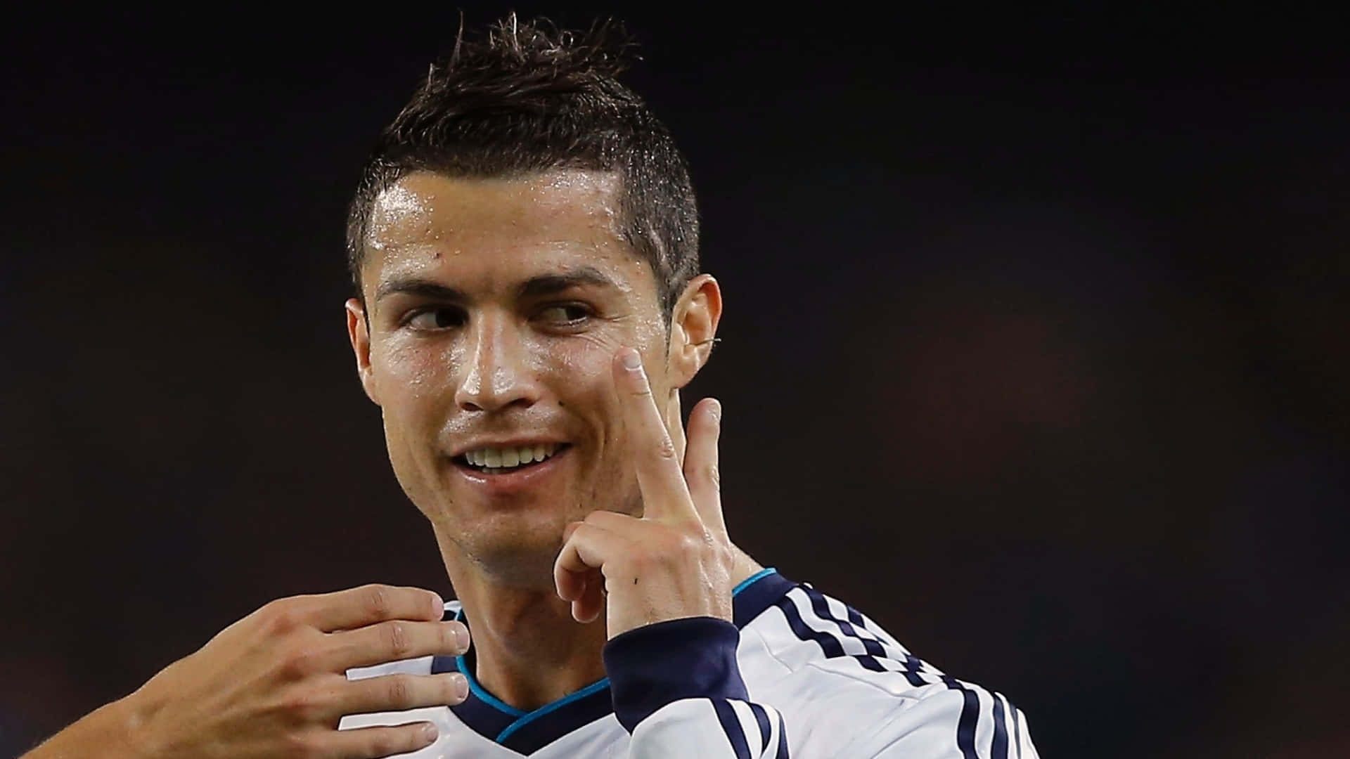 Cristiano Ronaldo striking an iconic pose on the football field