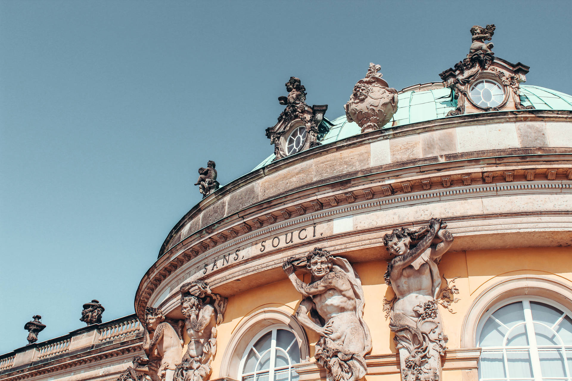 Majestic Sculptures Adorning the Rooftop of Sanssouci Palace, Potsdam Wallpaper