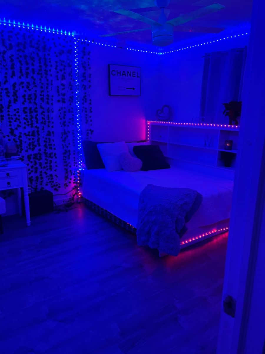 A Bedroom With Blue And Purple Lights