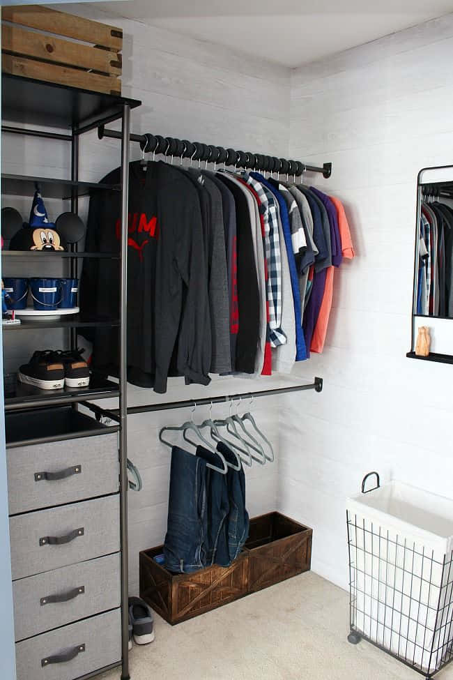 A Closet With Clothes And A Mirror