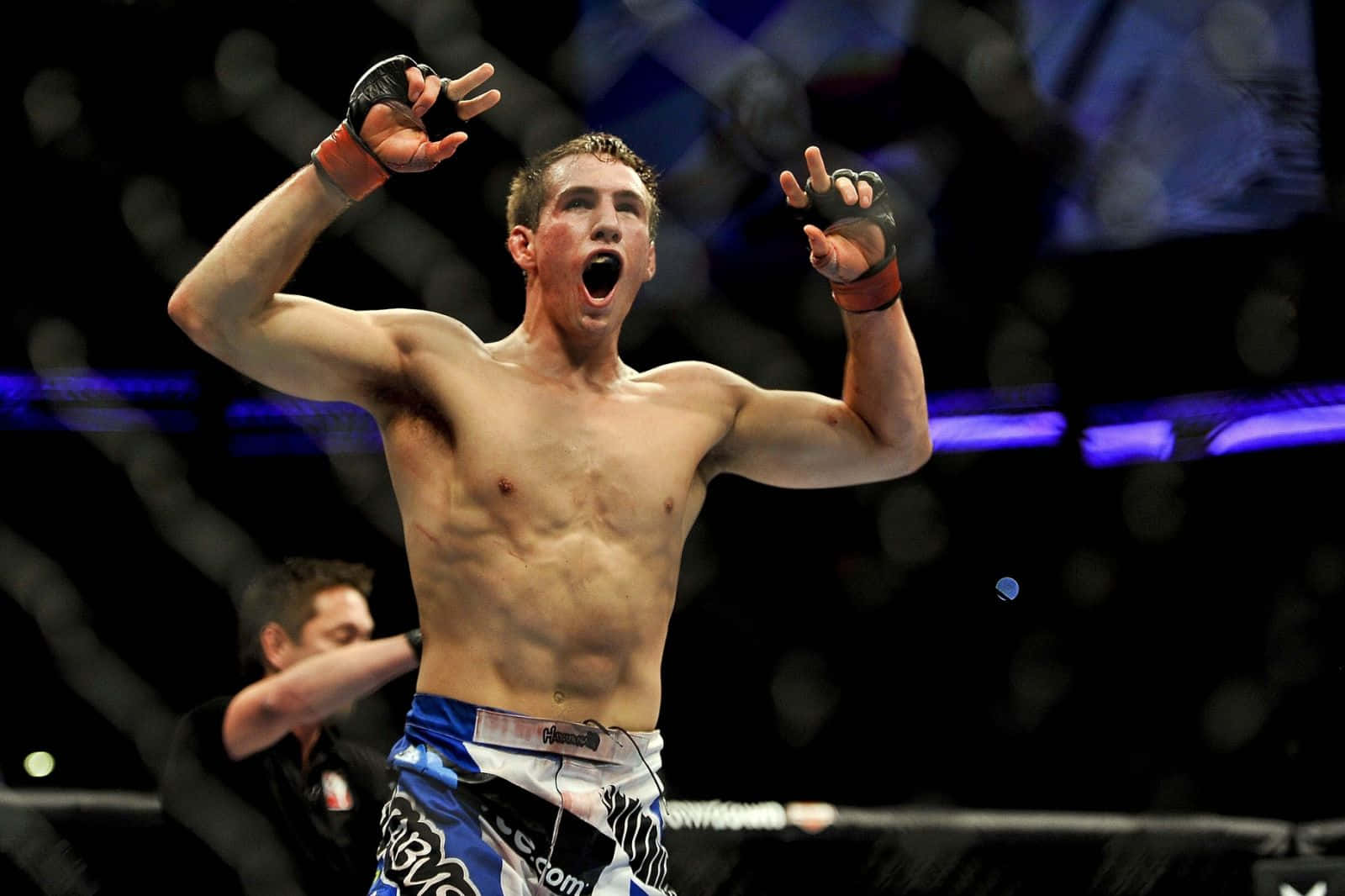 Rory MacDonald Celebrating In The Octagon Wallpaper