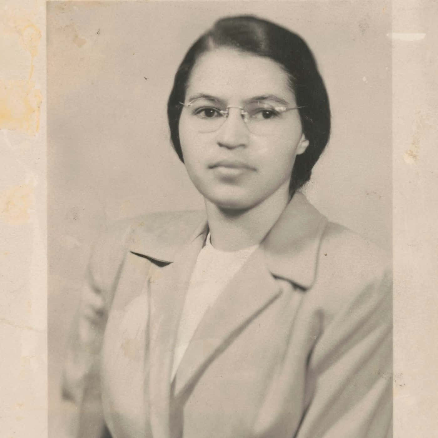 A Woman In Glasses Is Posing For A Photo