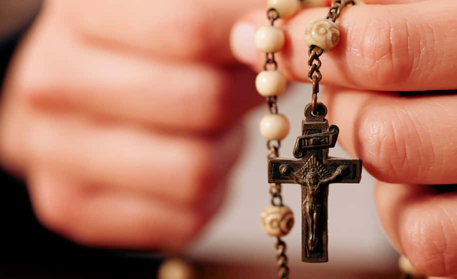 Person Holding A Rosary Picture