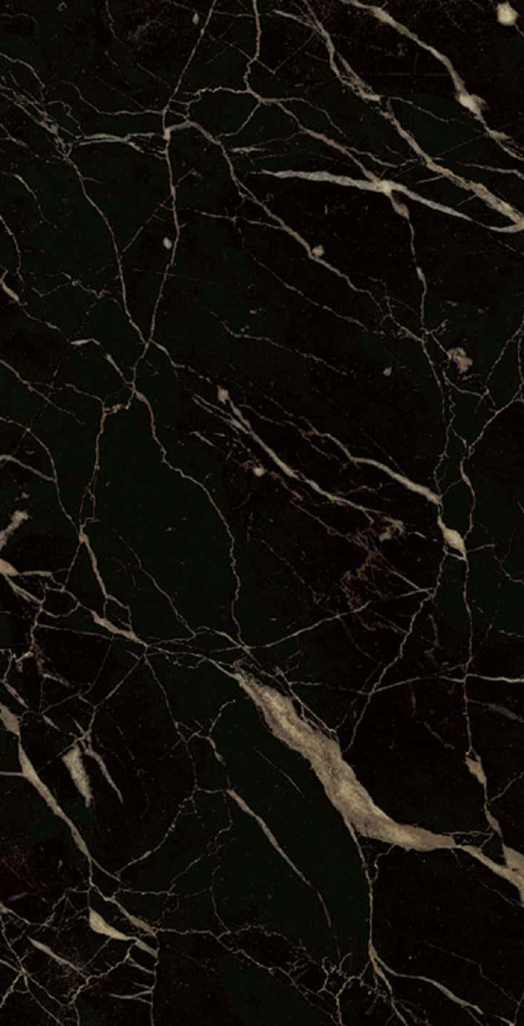 A Black Marble Tile With Gold Veins Wallpaper