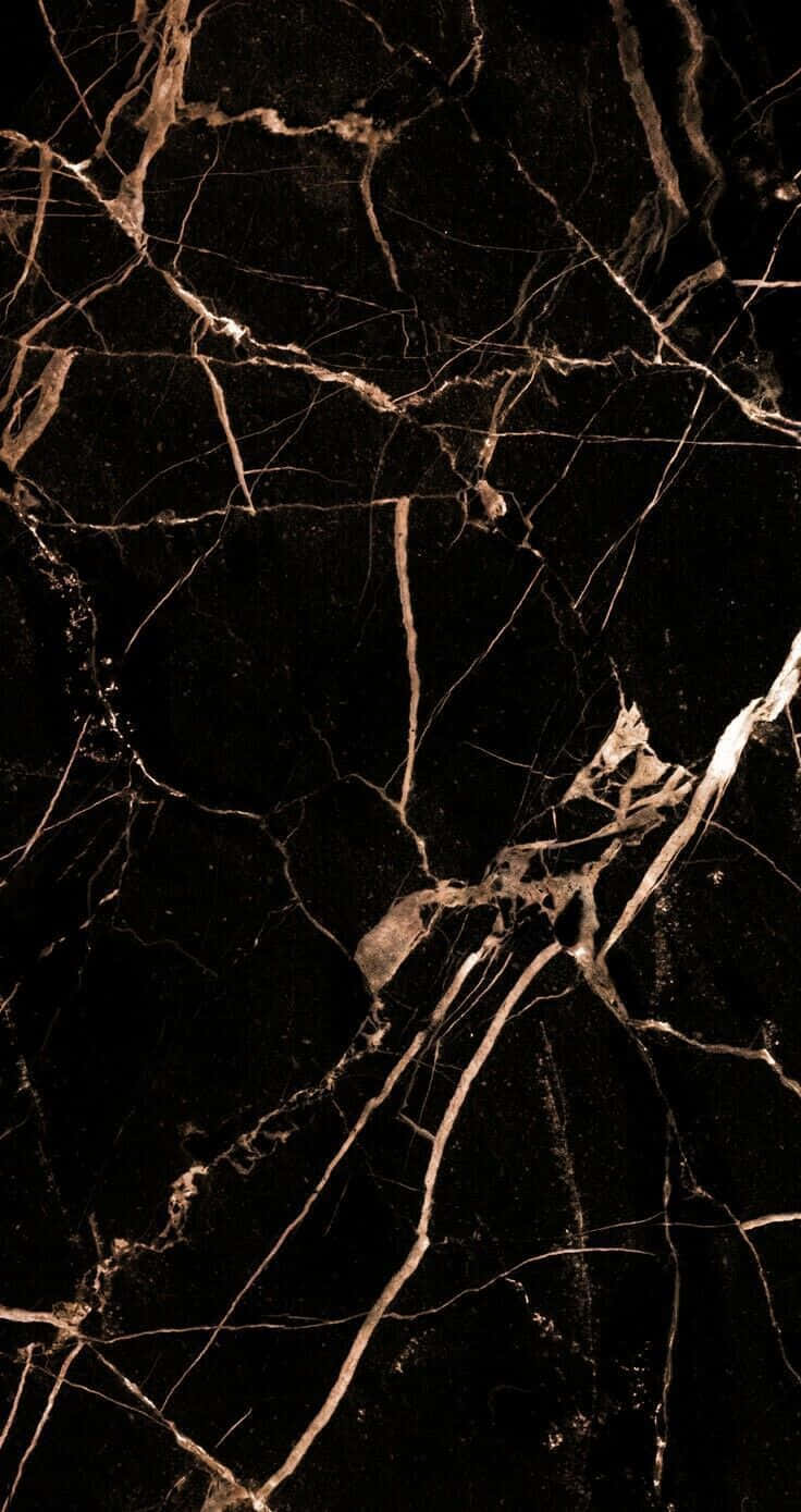 Glittering Rose Gold accents against a Dark Black Marble Background Wallpaper
