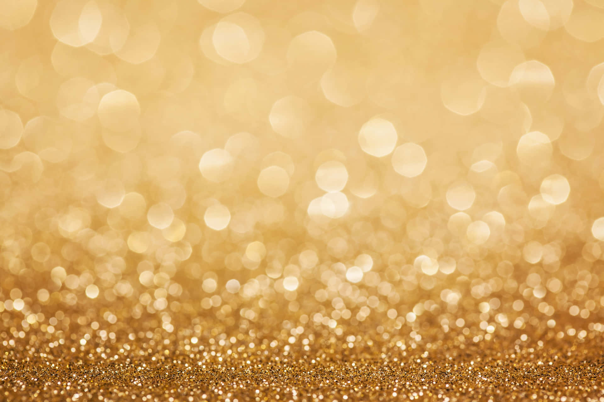 A Golden Glitter Background With Bokeh Wallpaper