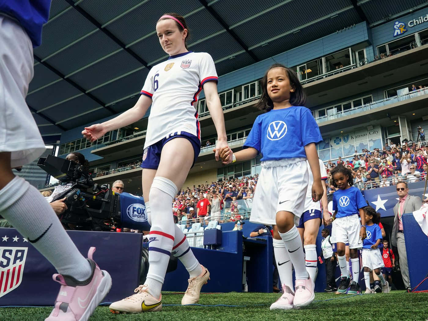 Rose Lavelle In Action During A Soccer Match Wallpaper