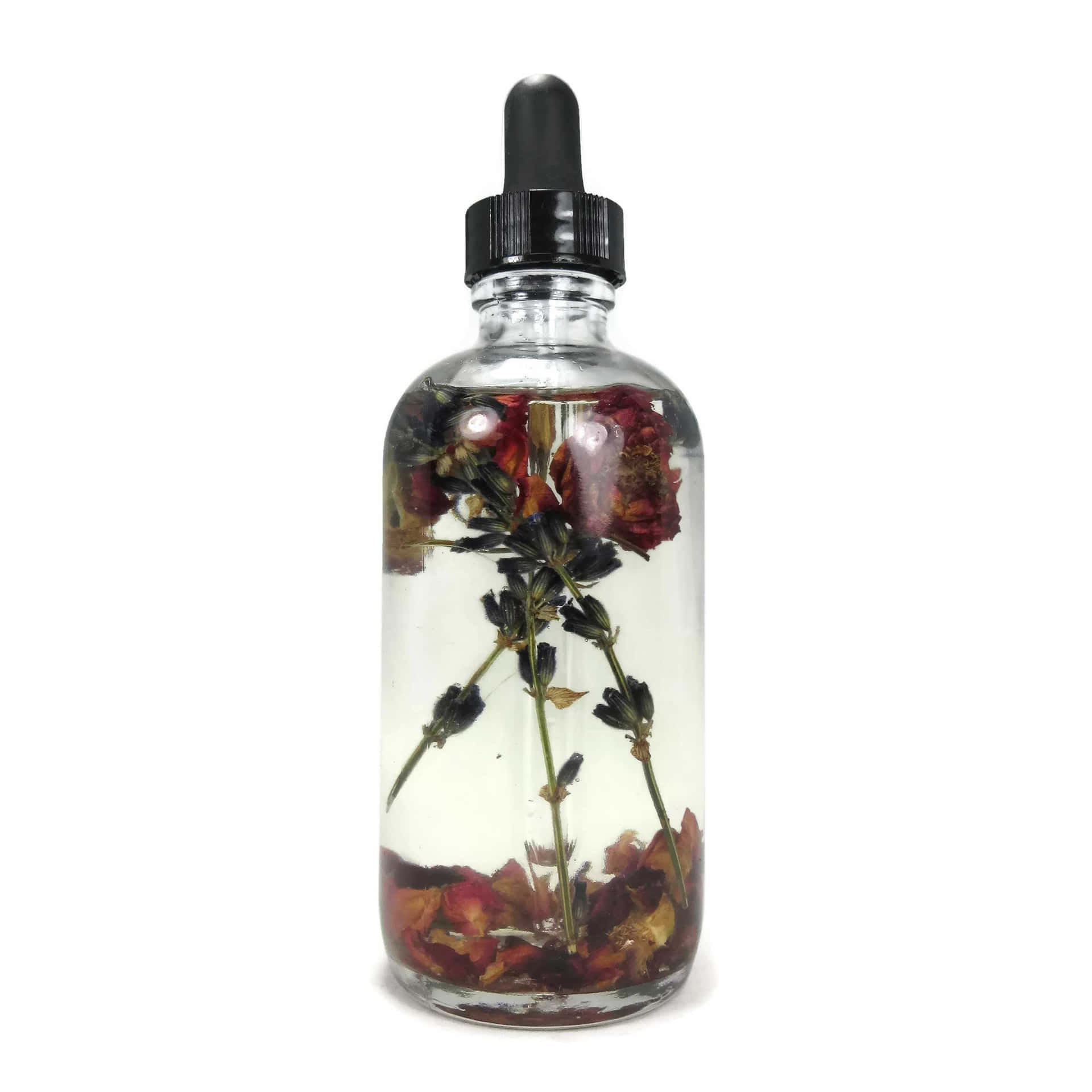 Divine Rose Oil in a Luxurious Bottle Wallpaper