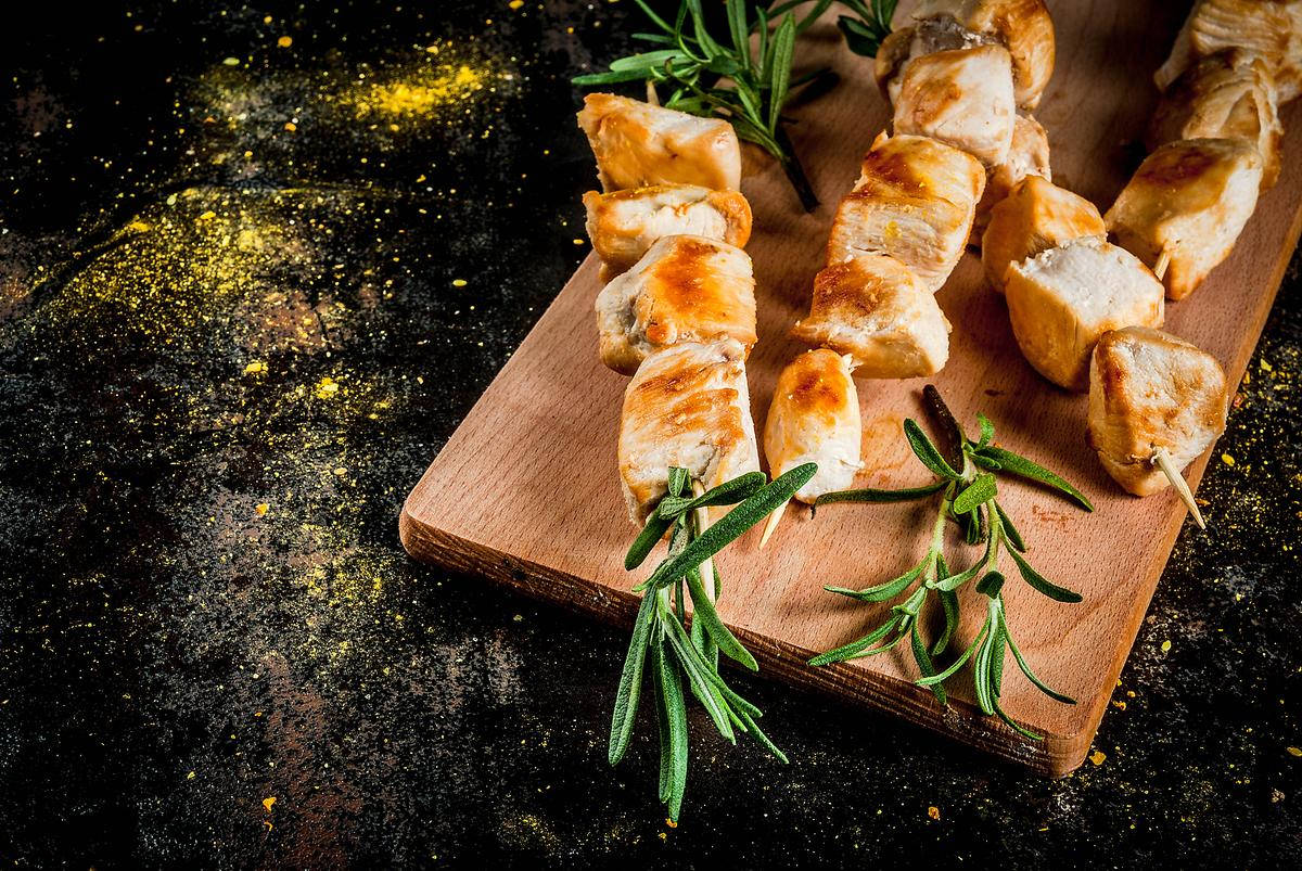 Aromatic Rosemary with Succulent Kebabs on Chopping Board Wallpaper