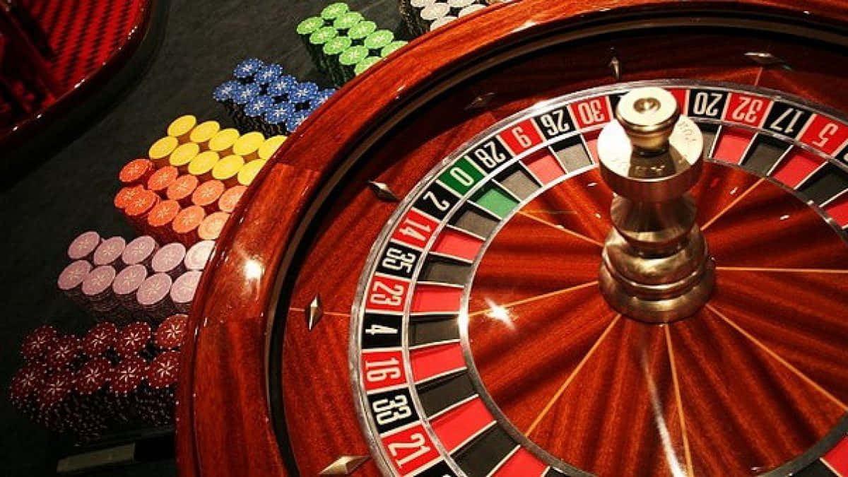 Roulette Wheel With Various Chips Wallpaper