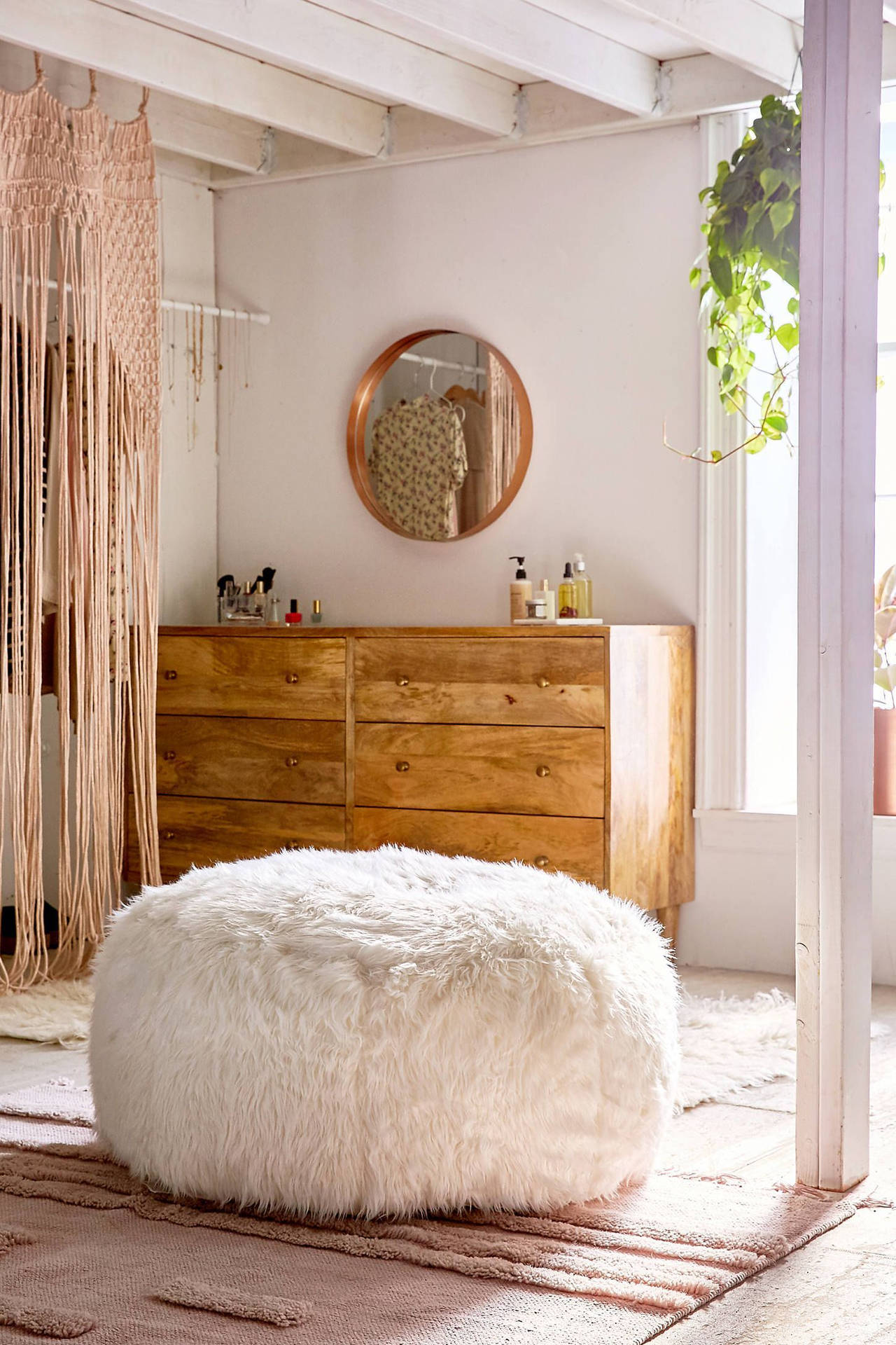 Round Fur Couch Inside A Stylish Room Wallpaper