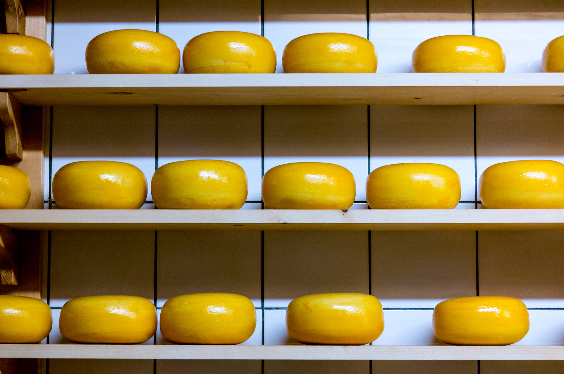 Round Yellow Cheese On Shelf
