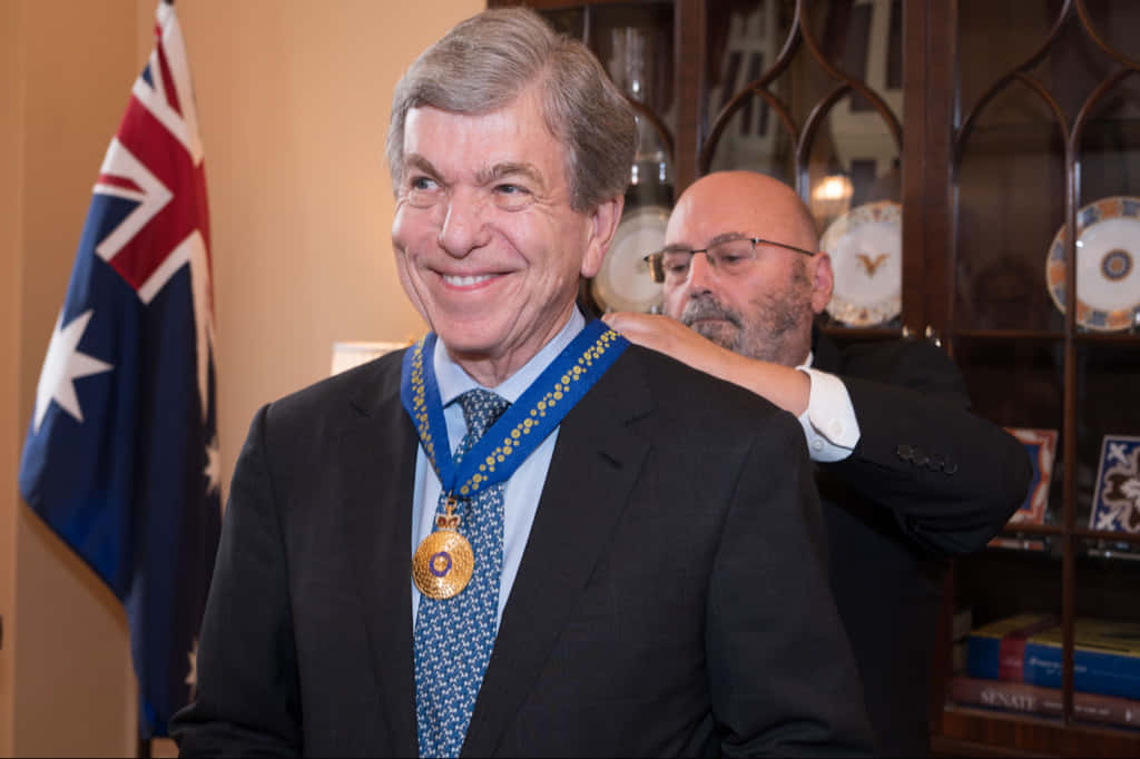Honorable Senator Roy Blunt Holding a Prestigious Medal Wallpaper