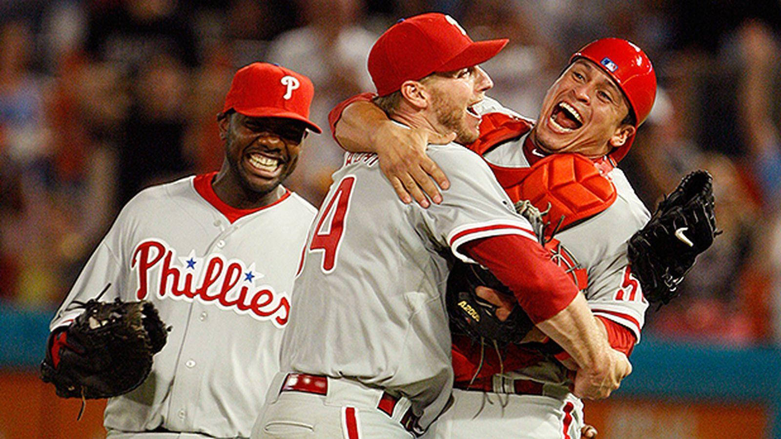 Download Roy Halladay Celebrating With Teammates Wallpaper