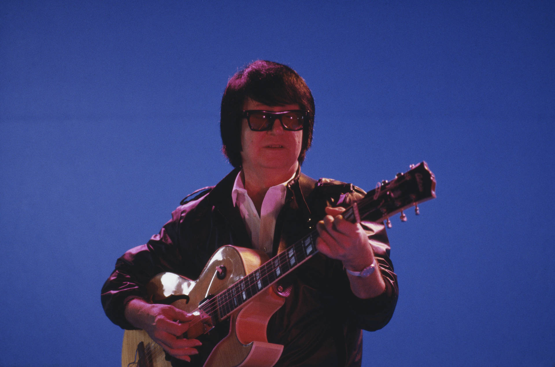 Roy Orbison Live Performance Blue Background Wallpaper